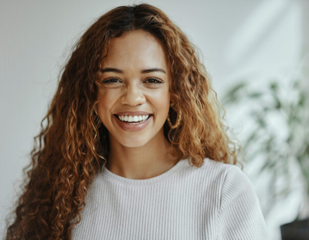 Woman with curly hair smiling